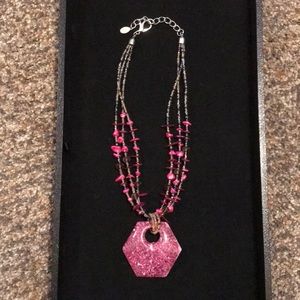 Fuschia-colored beaded necklace with pendant